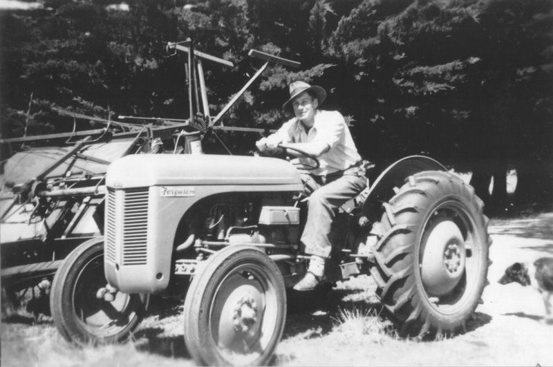 Maurice May on tractor, circa 1948